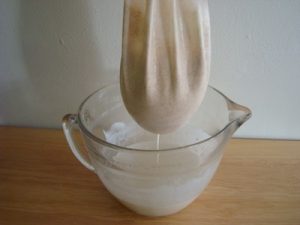 Dripping Almond Milk In Nut Bag